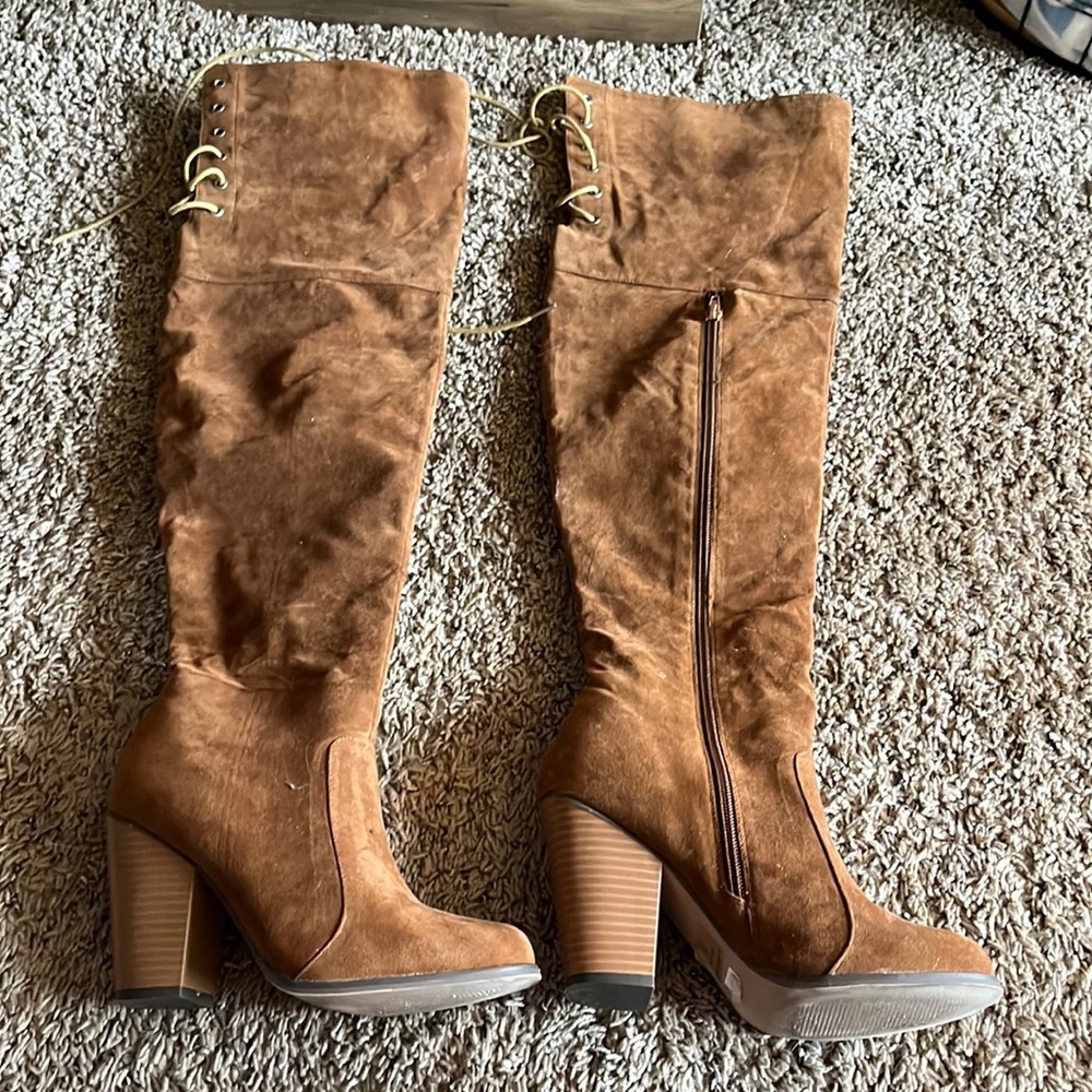Brown suede, lace up knee high boots.